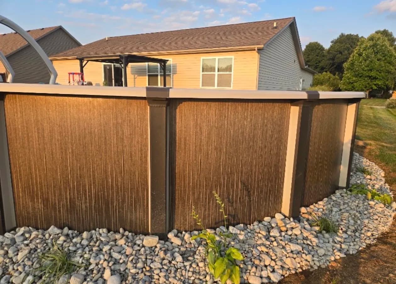 Above-Ground Pool Landscaping with River Rock in Mason Ohio image