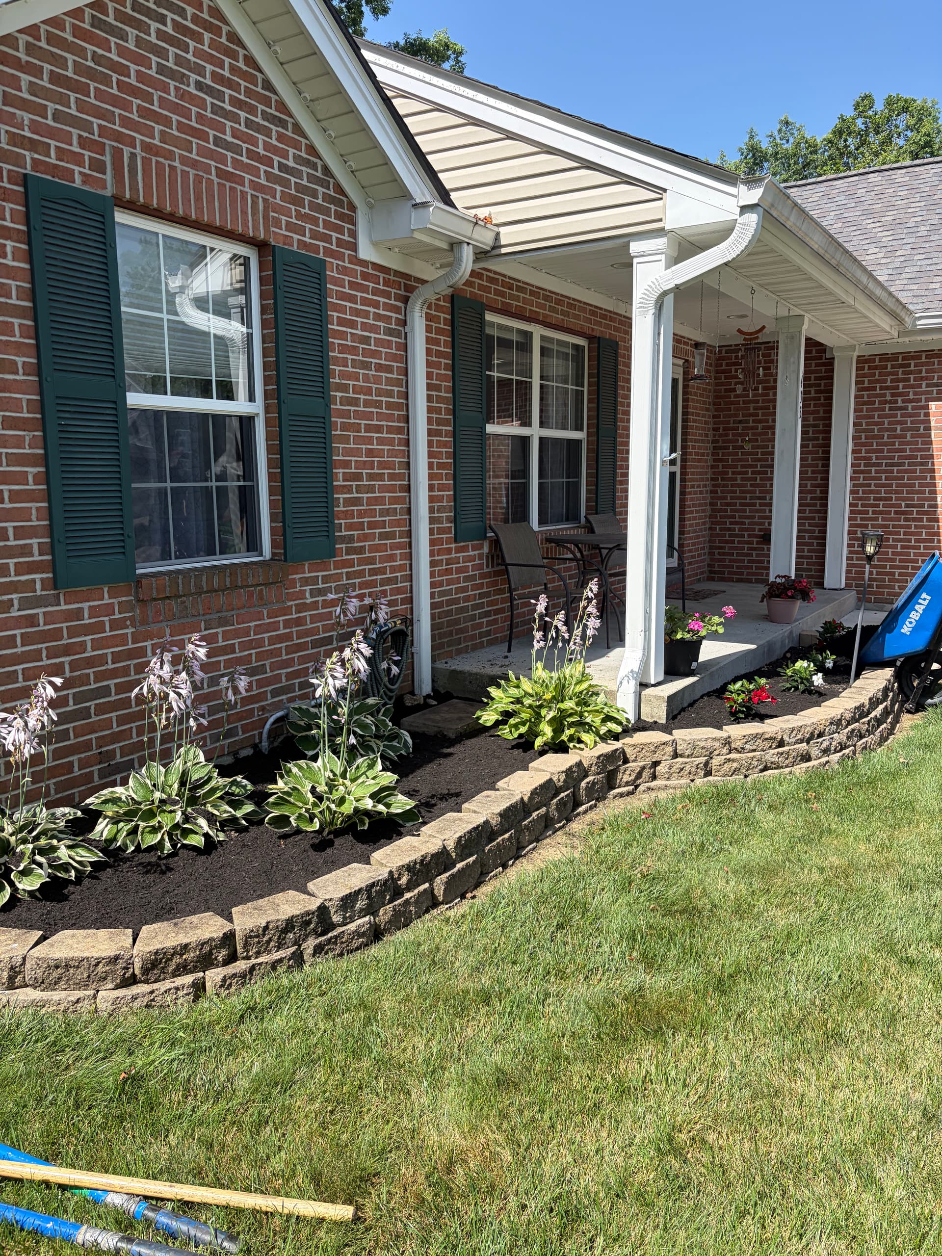 Garden Bed Refresh with New Plants and Fresh Mulch image